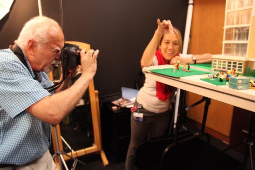 Phil Jones and Tricia Perea set scenes in the photo studio.