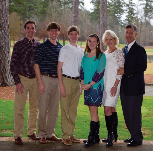 Dr. Mark Newton (right) with his family, Bradley, David, Daniel, Christy and wife Joni.