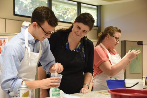 Amanda Behr (center) teaches a class.