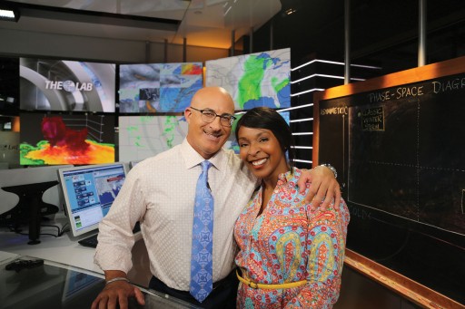 Photo by The Weather Channel. Alana Leverette with meteorologist Jim Cantore in the studio.