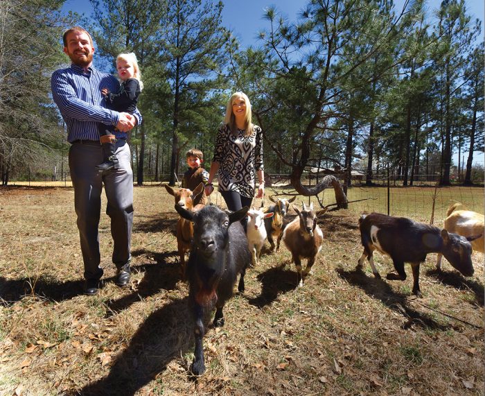 Billy, Blakely, Bentley and Mandi Brinson walk the goats. Photo by Phil Jones. 