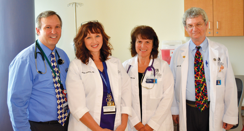 Drs. Johnson and David Munn with pediatric nurse practitioners Robin Dobbins and Beth Fisher