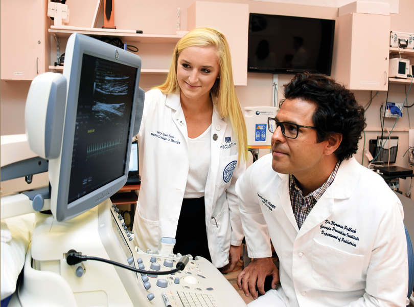 MCG student Mary Ellen Fain and Dr. Norman Pollock