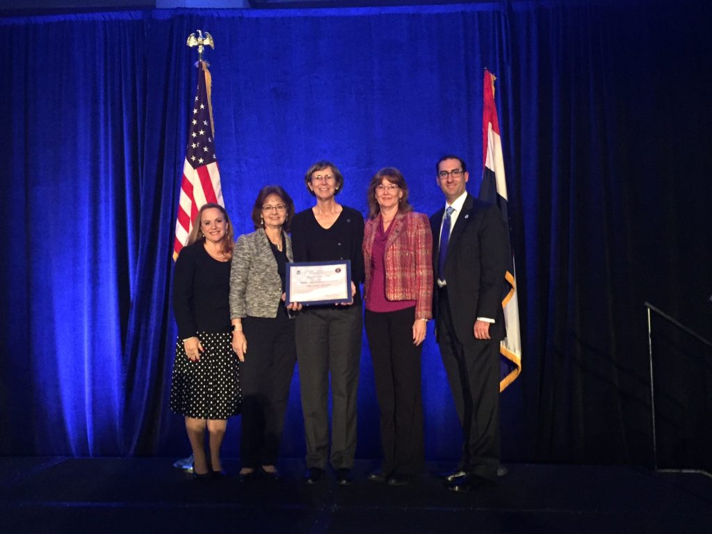 Joanne Sexton (center), director of Augusta University's Cyber Institute, accepts the university's official designation at the 2016 National Initiative for Cybersecurity Education Conference (NICE) in Kansas City, Missouri. 